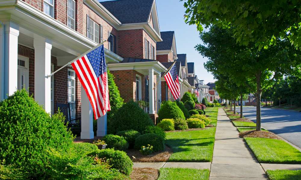 HOA Community with American Flags and sidewalk